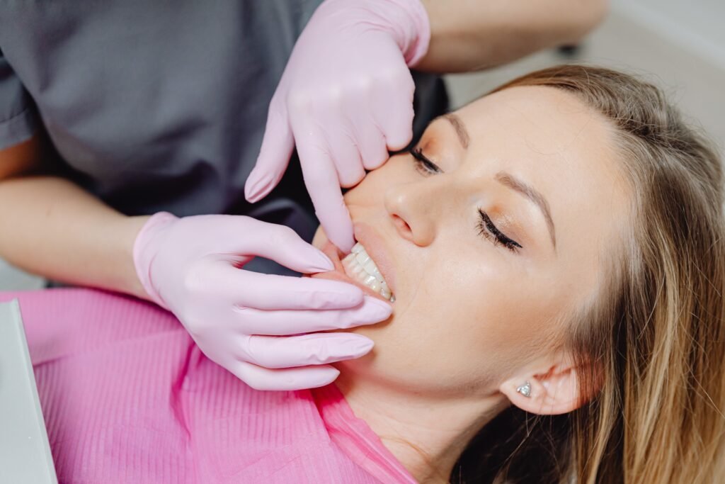 A patient during bite alignment evaluation at Smiles by Design Dental Spa in Fort Mill, SC. 